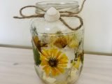 Yellow flower and shell candle jar